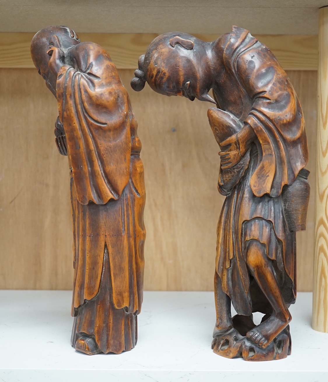 Two 19th century Chinese bamboo root figures of a fisherman and Shou Lao, tallest 32cm. Condition - fair to good